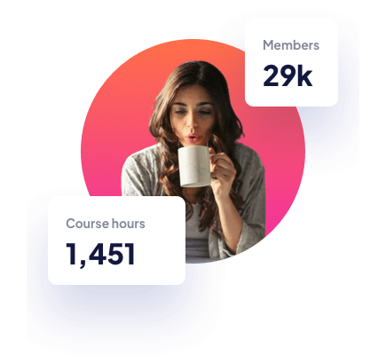 woman sipping from mug while sitting in front of computer